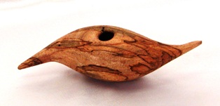 Off-center turned, hollowed, carved, and textured